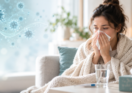 Evde mendil kullanan grip belirtileri yaşayan bir kişi; arka planda influenza virüsü illüstrasyonu